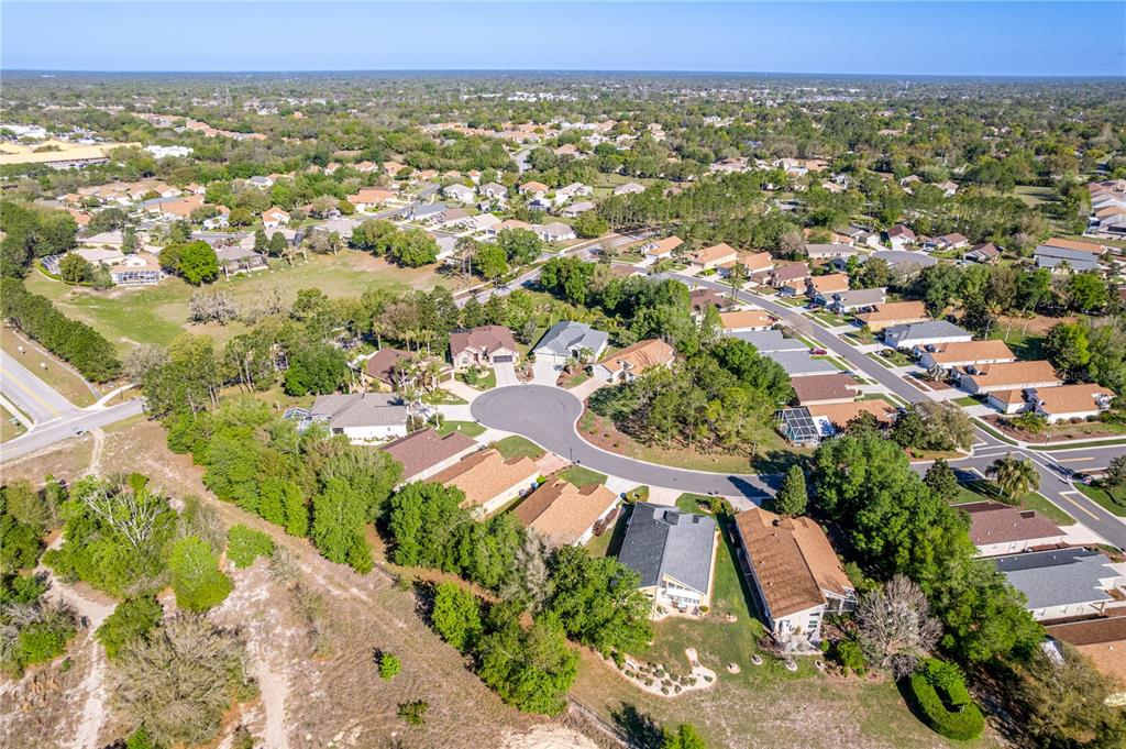 150 Gordham Court Spring Hill, FL 34609 - Photo 63 of 71 an aerial view of residential houses with outdoor space and trees