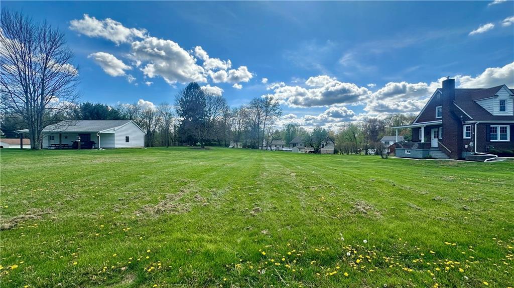 a view of a house with a big yard