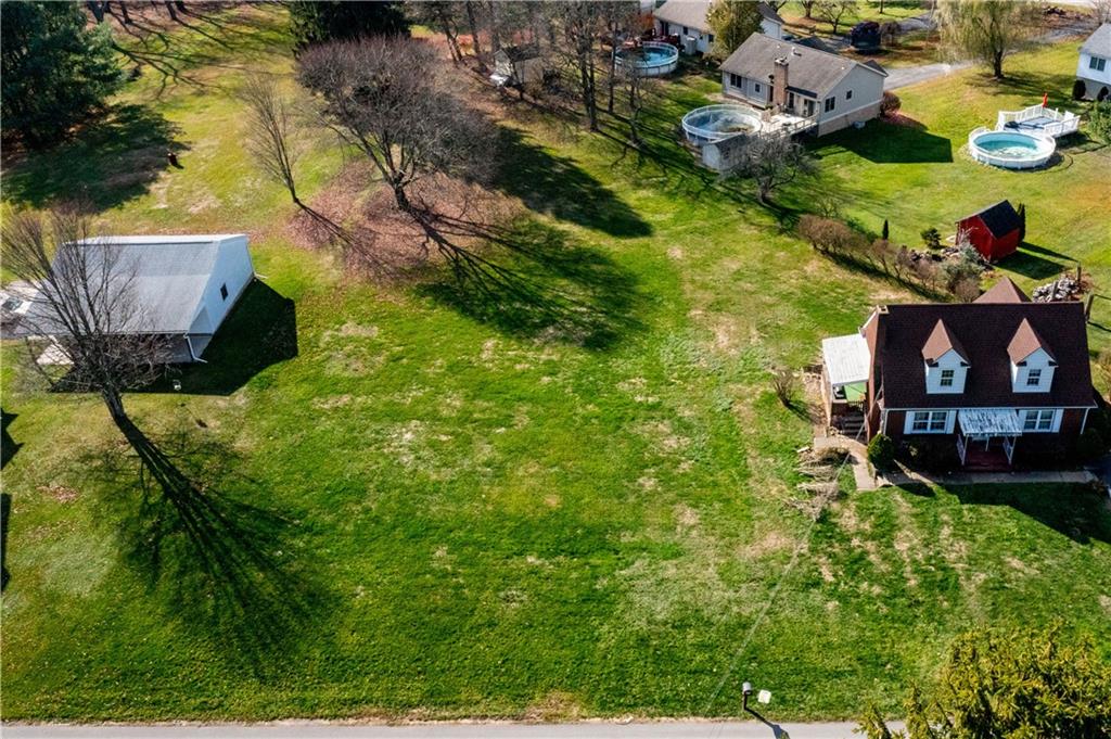 -lot Tuscarawas Road Beaver, PA 15009 - Photo 2 of 9 a view of a back yard of the house and car parked