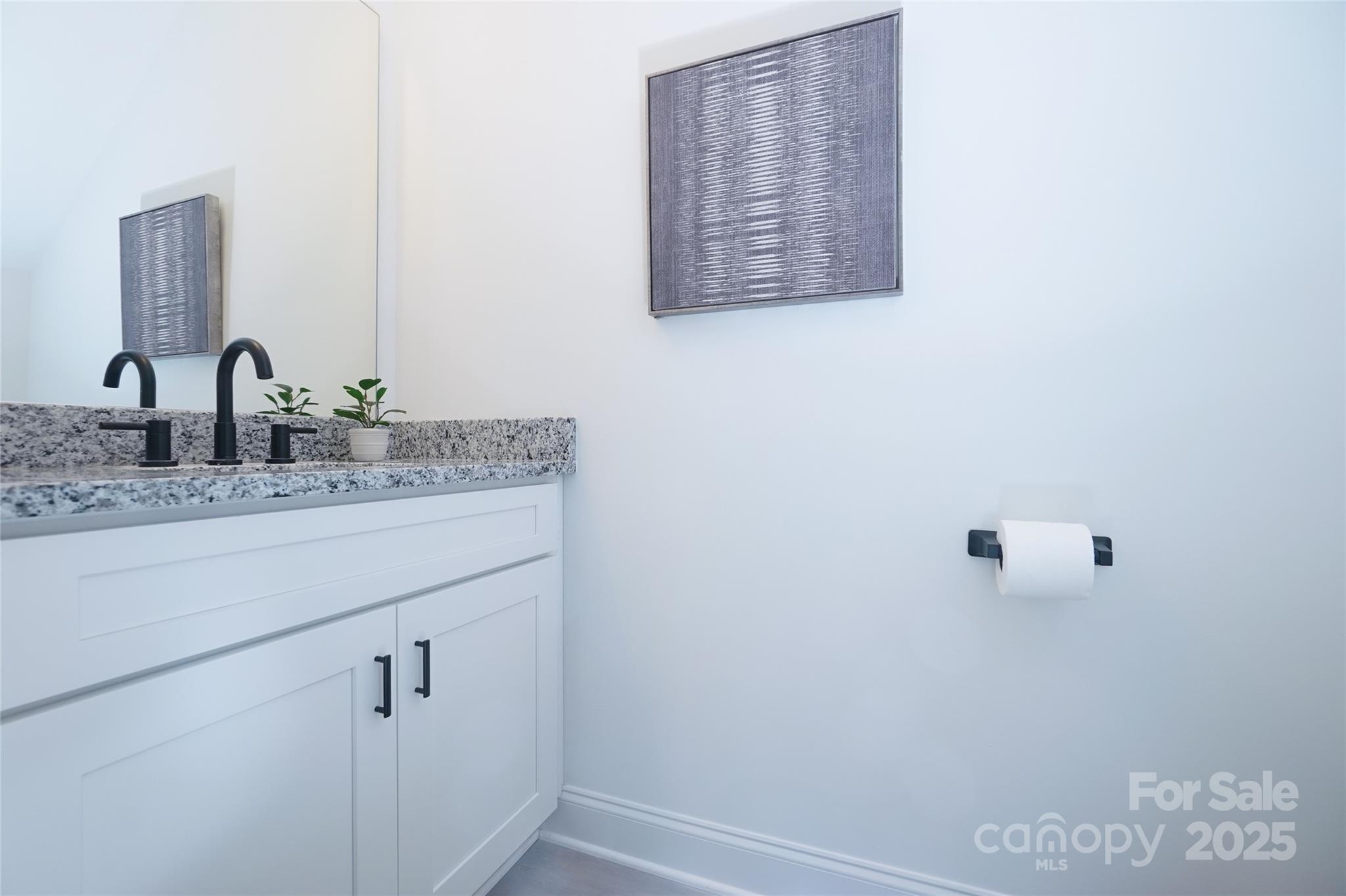 3224 Sam Wilson Road Charlotte, NC 28214 - Photo 15 of 32 a bathroom with a granite countertop sink and a mirror