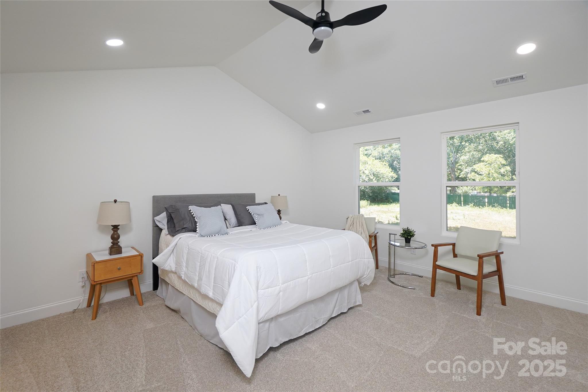 3224 Sam Wilson Road Charlotte, NC 28214 - Photo 18 of 32 a bed room with a bed and a chair
