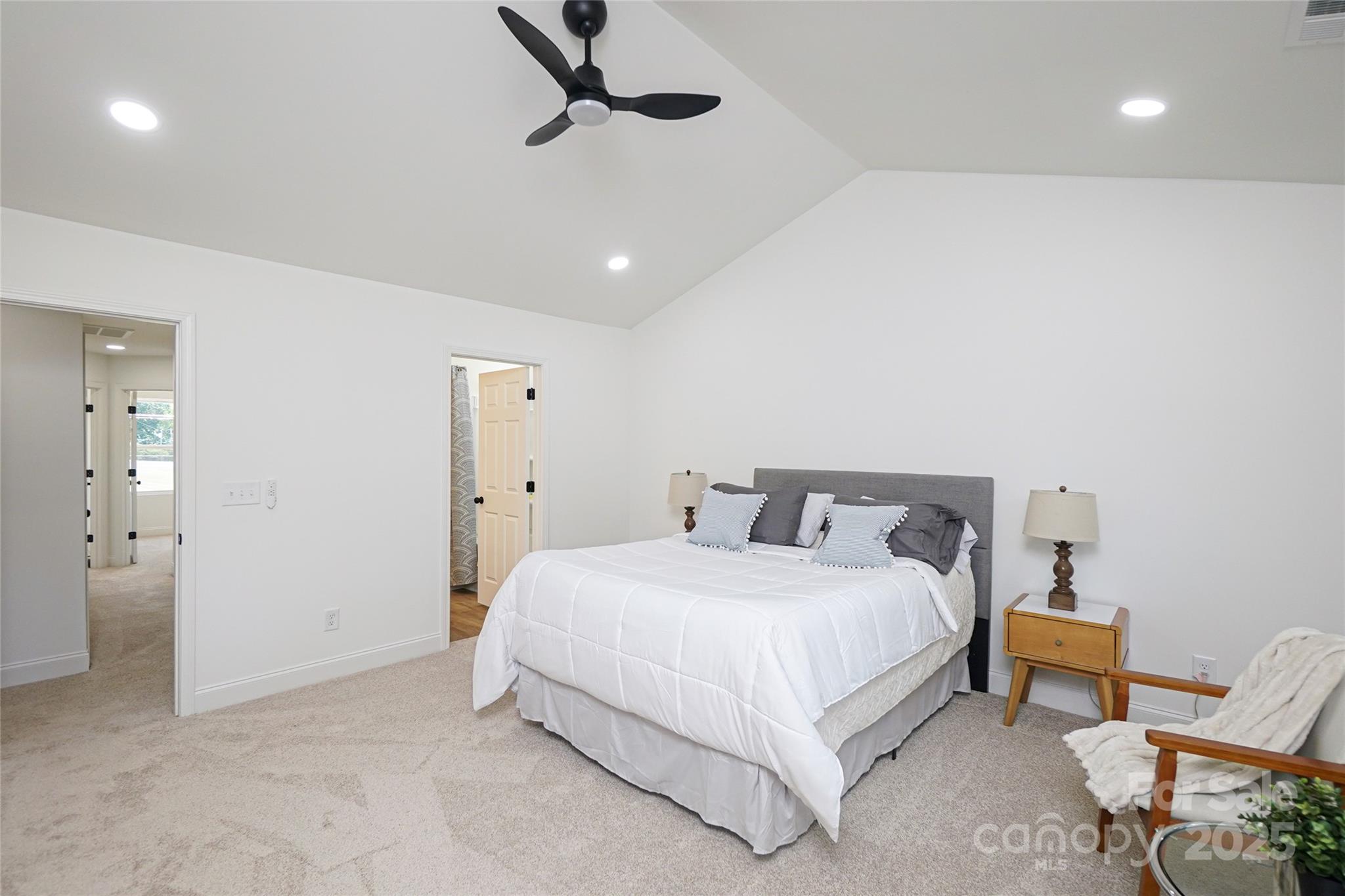 3224 Sam Wilson Road Charlotte, NC 28214 - Photo 19 of 32 a bedroom with a bed and a chair