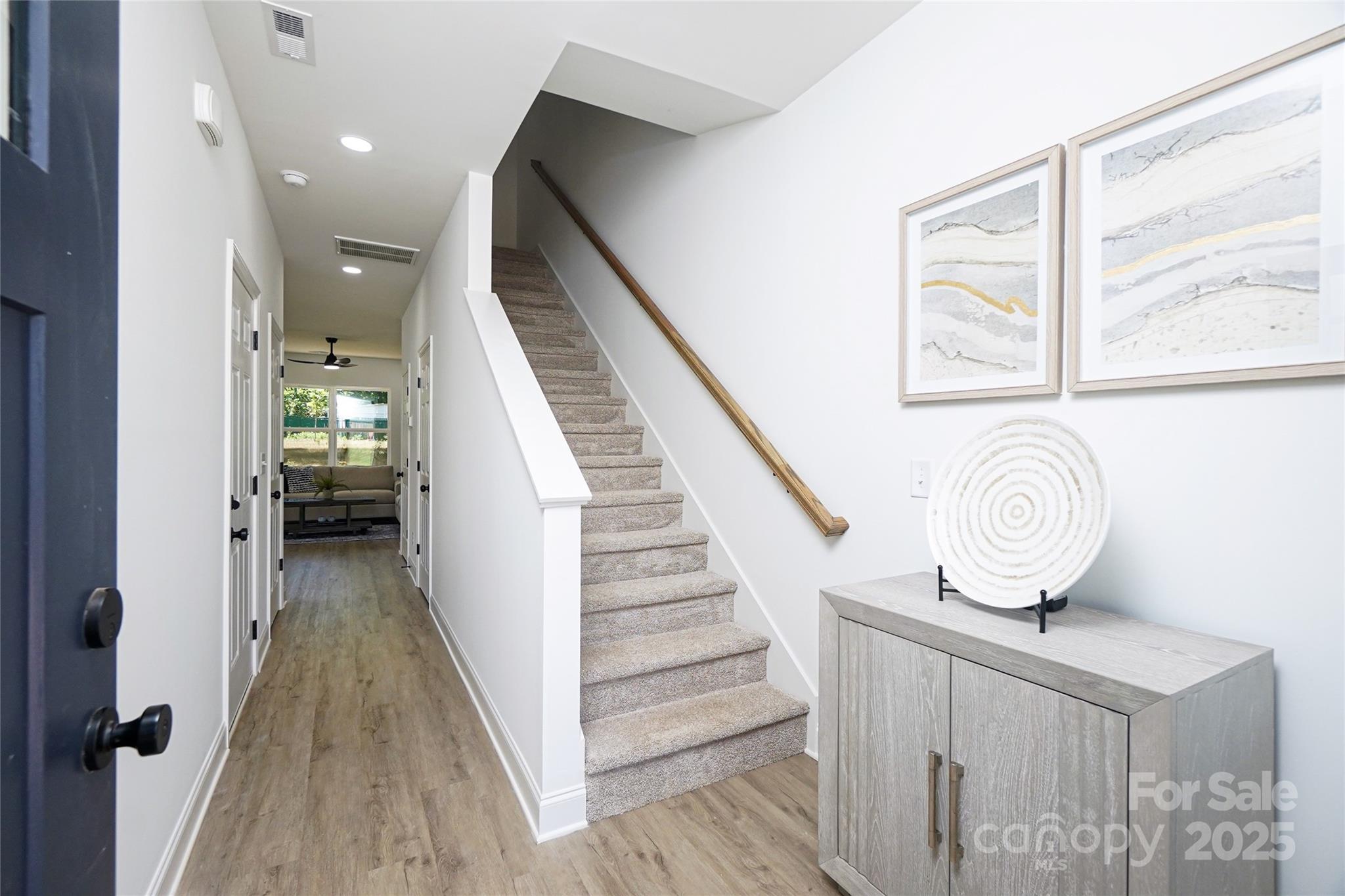 3224 Sam Wilson Road Charlotte, NC 28214 - Photo 3 of 32 a view of entryway and hall with wooden floor