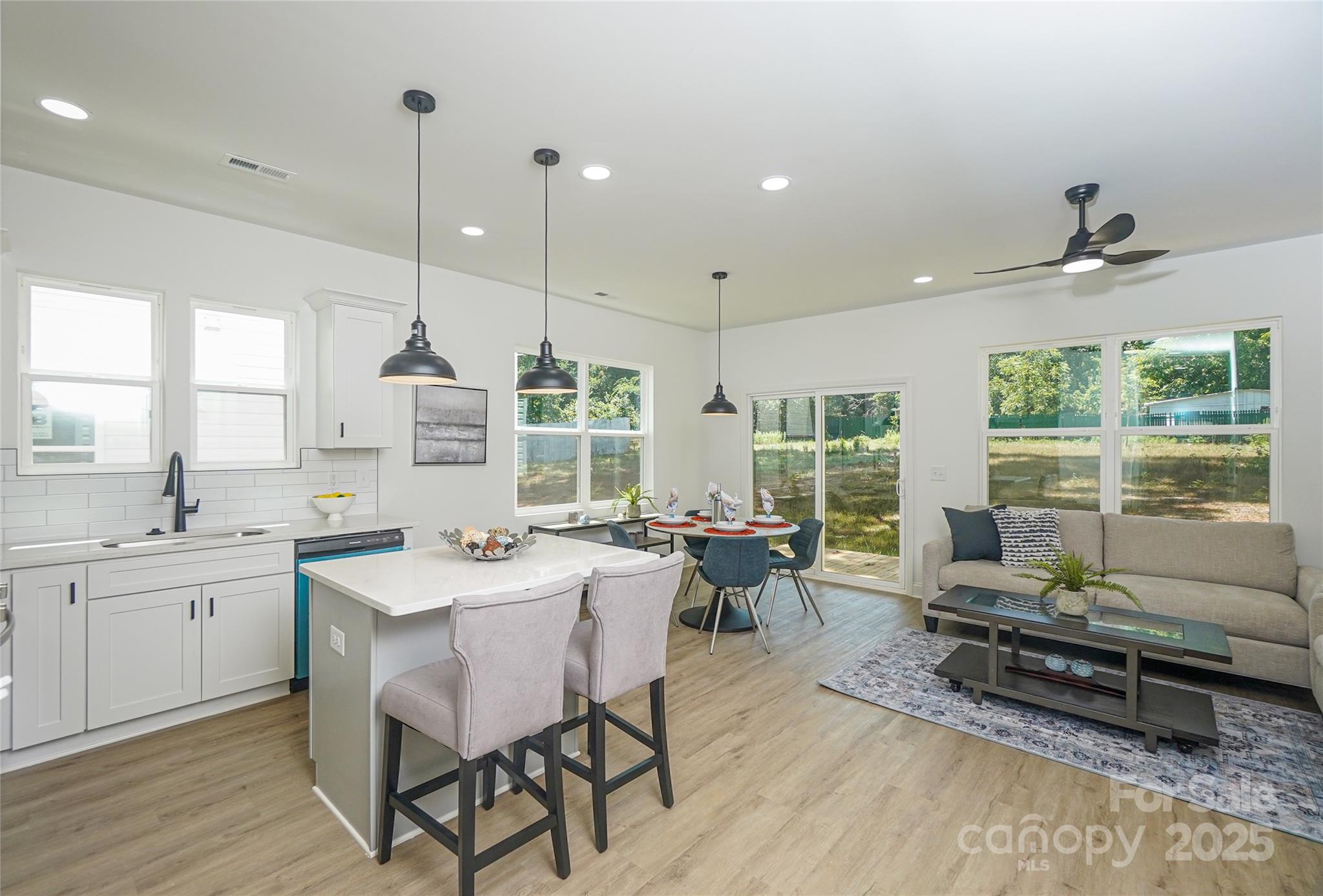 3224 Sam Wilson Road Charlotte, NC 28214 - Photo 4 of 32 a dining room with furniture window and wooden floor