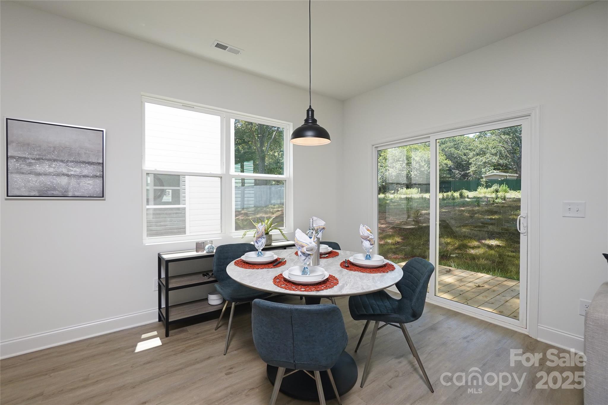 3224 Sam Wilson Road Charlotte, NC 28214 - Photo 8 of 32 a view of a dining room with furniture window and outside view