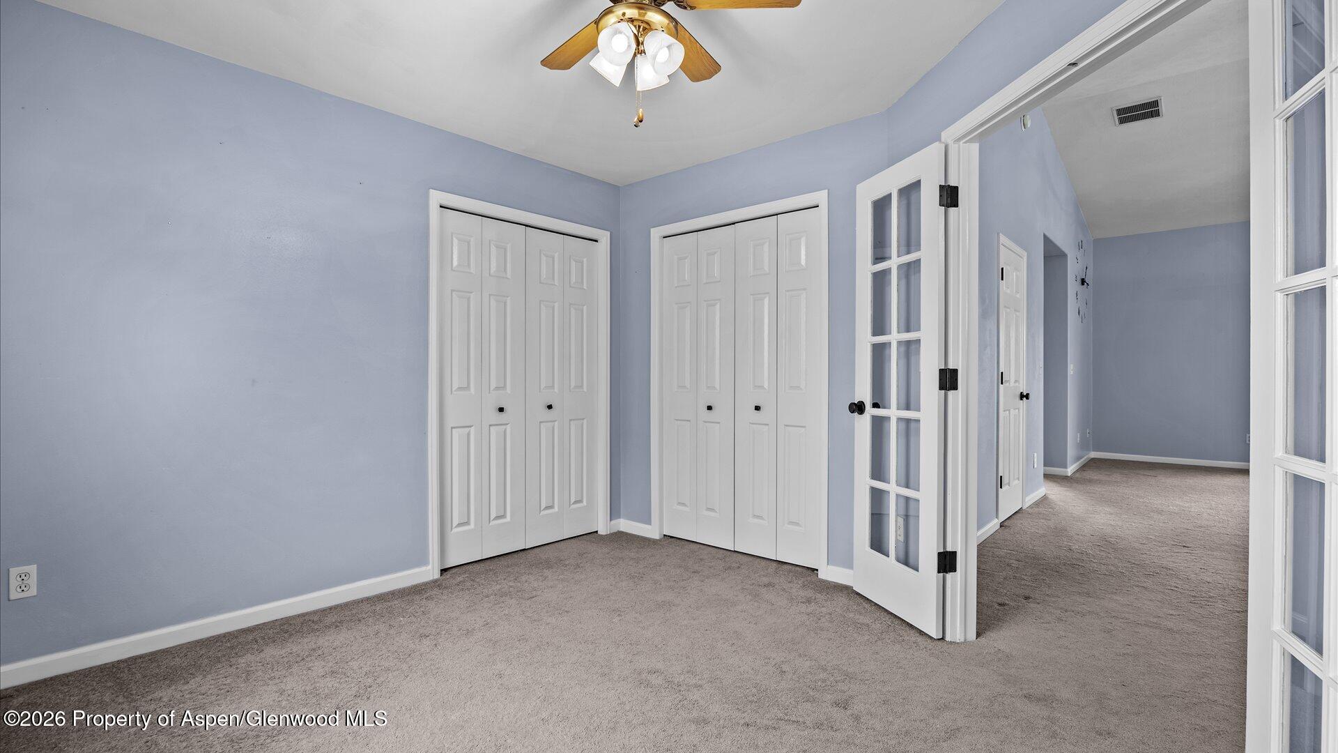 1459 Anvil View Avenue Rifle, CO 81650 - Photo 11 of 29 a view of a livingroom with a chandelier fan