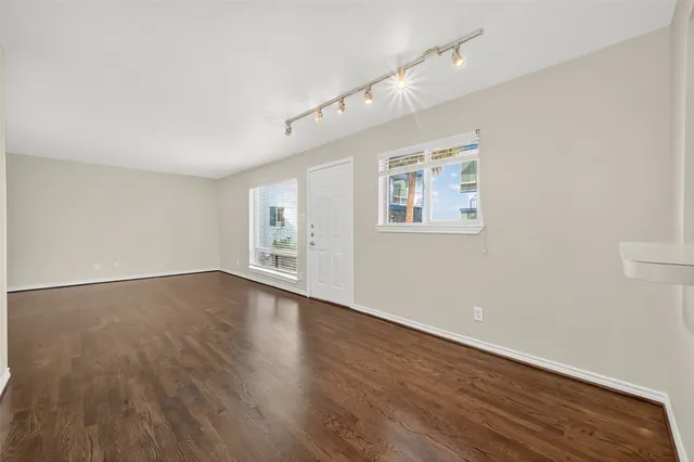 a view of a livingroom with wooden floor