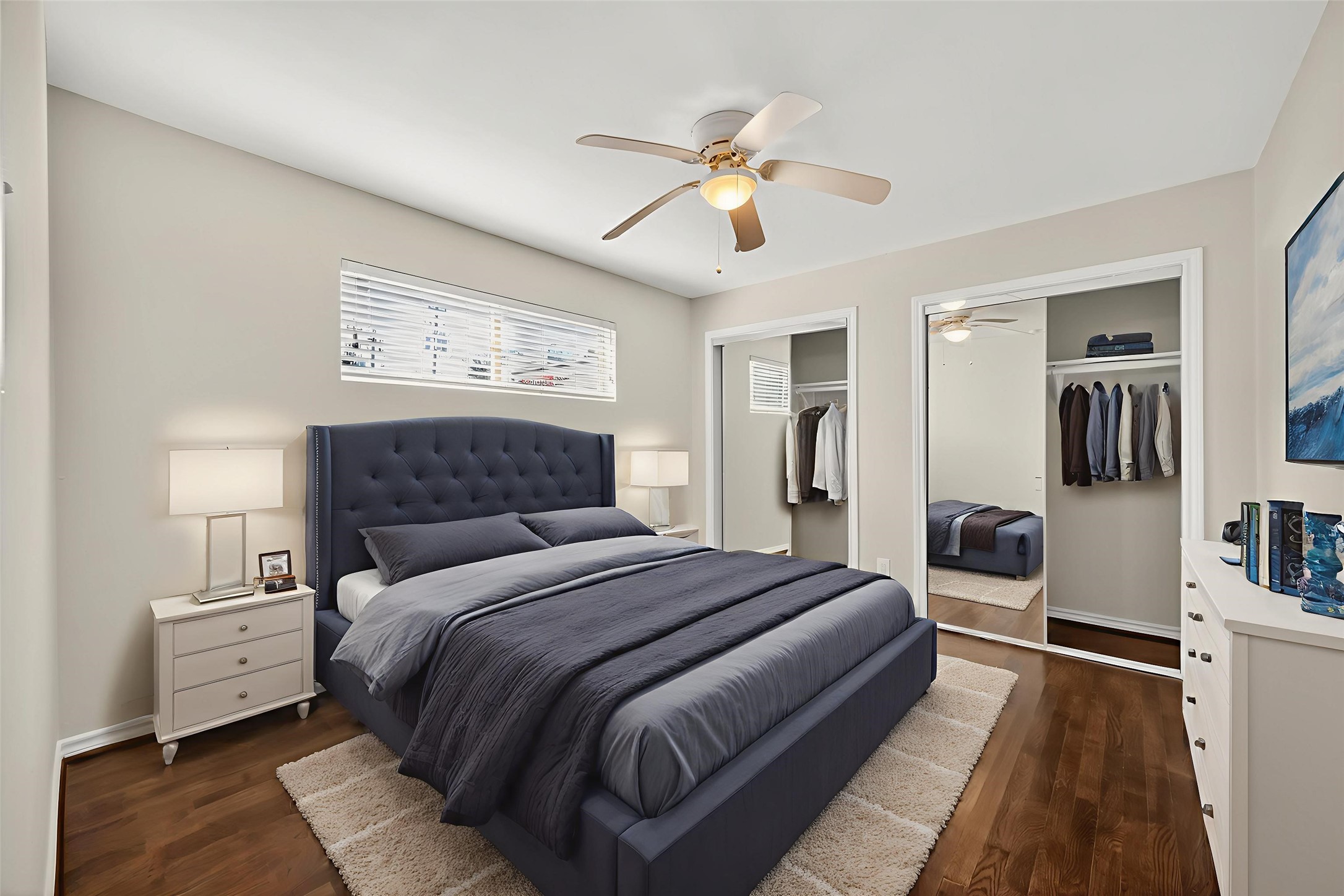 2020 Huldy Street, Unit 1 Houston, TX 77019 - Photo 23 of 30 a bedroom with a large bed and a chandelier