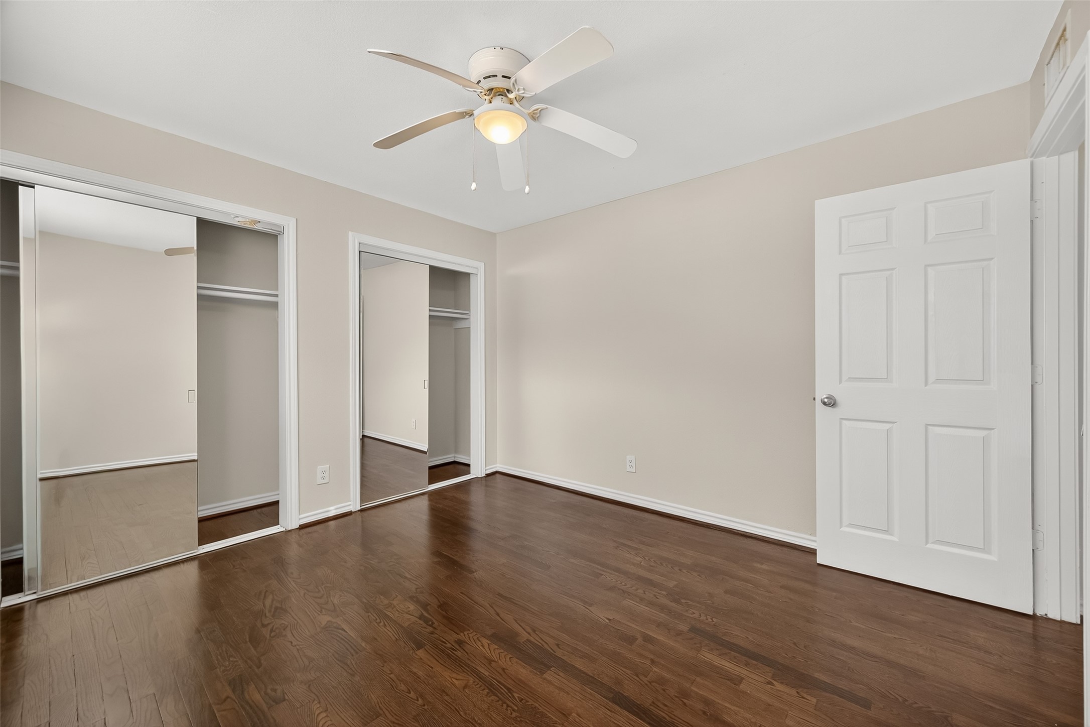 2020 Huldy Street, Unit 1 Houston, TX 77019 - Photo 24 of 30 an empty room with wooden floor ceiling fan