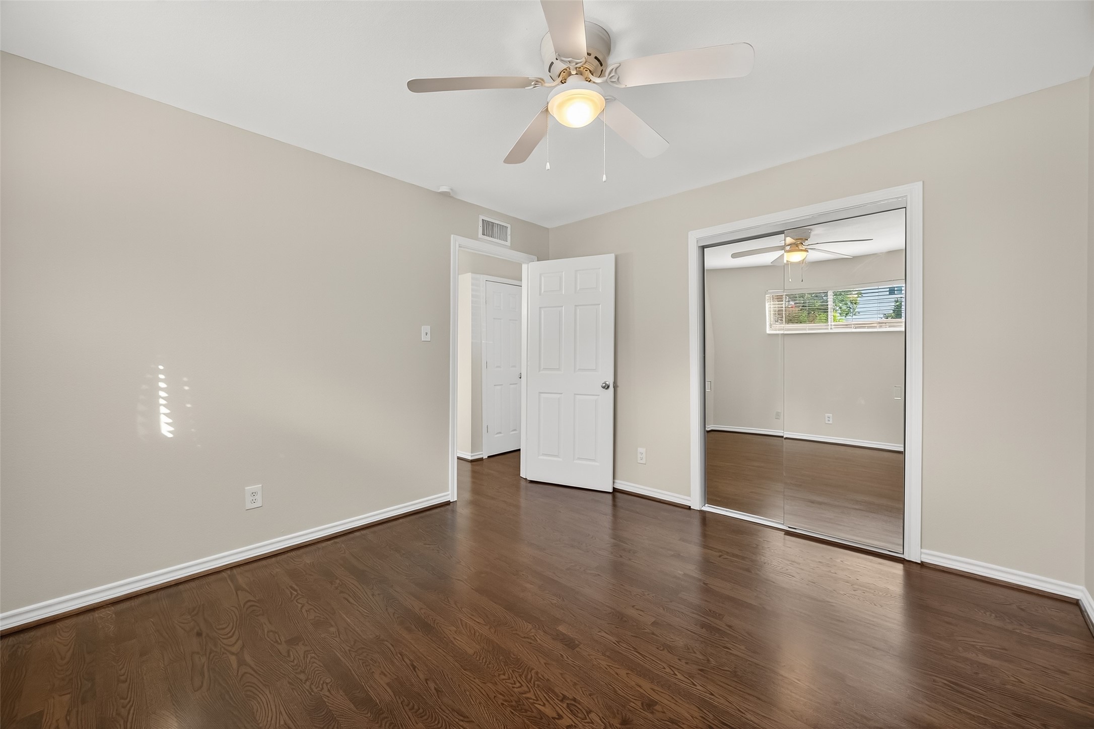 2020 Huldy Street, Unit 1 Houston, TX 77019 - Photo 29 of 30 wooden floor in an empty room with a window