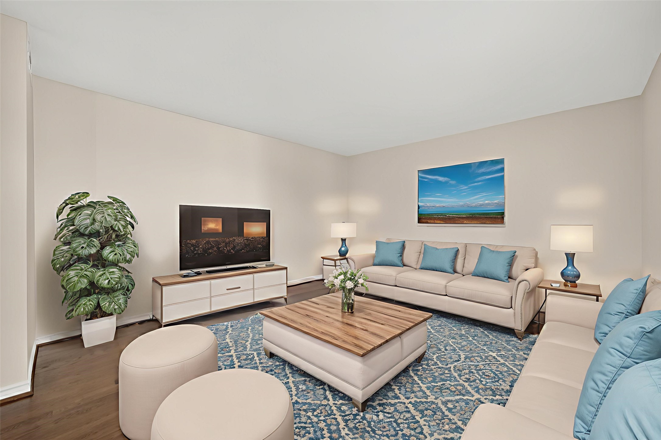 2020 Huldy Street, Unit 1 Houston, TX 77019 - Photo 9 of 30 a living room with furniture a flat screen tv and a wall painting