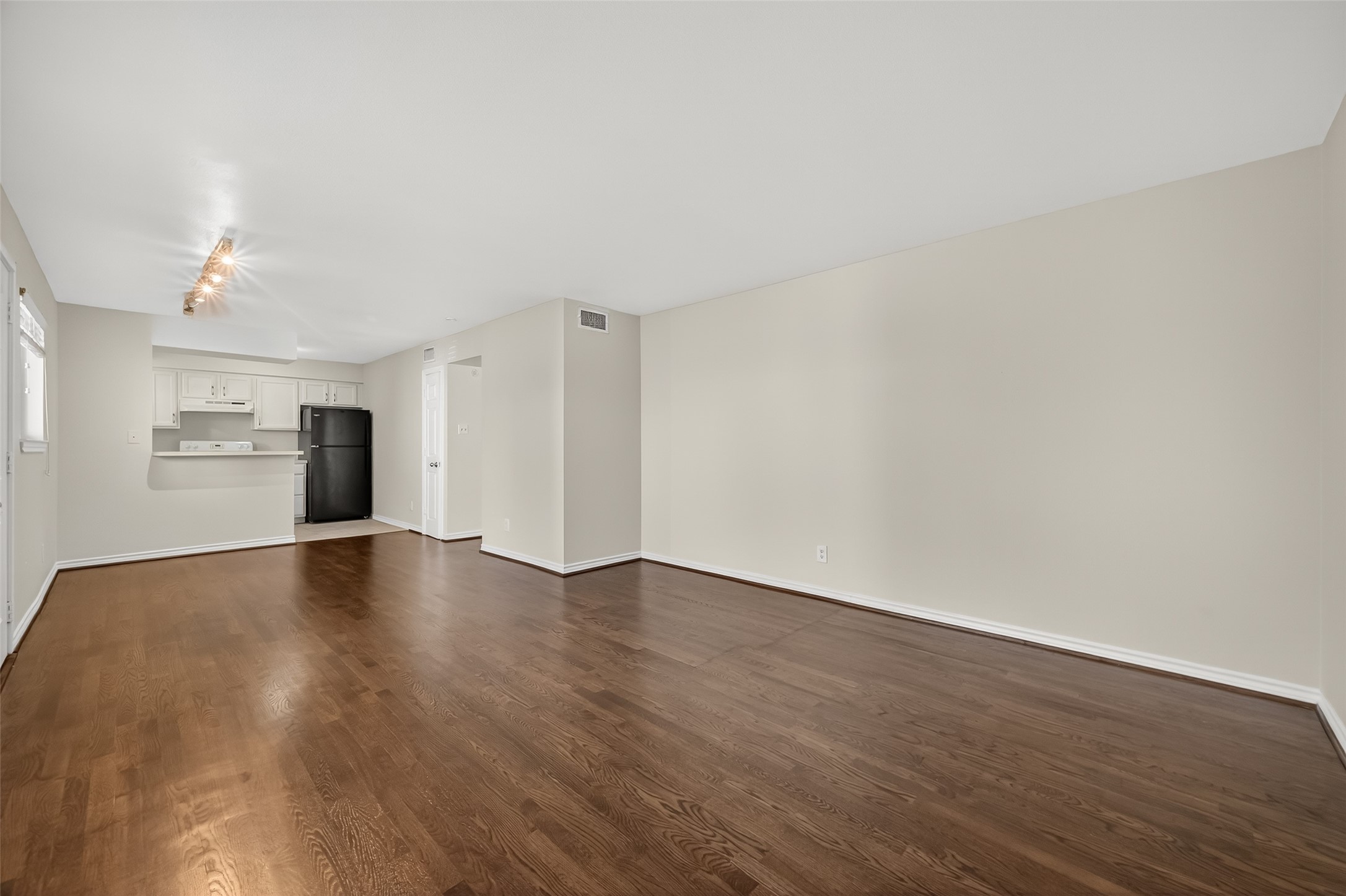 2020 Huldy Street, Unit 1 Houston, TX 77019 - Photo 10 of 30 a view of an empty room with wooden floor