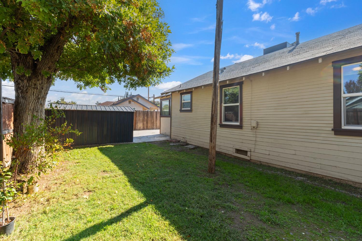 321 North Orange Avenue Exeter, CA 93221 - Photo 25 of 37 a view of a house with a yard