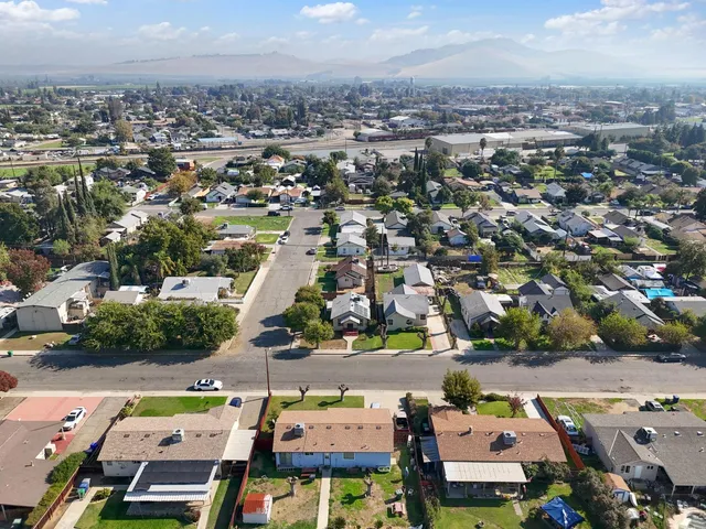 an aerial view of a houses with a lake view