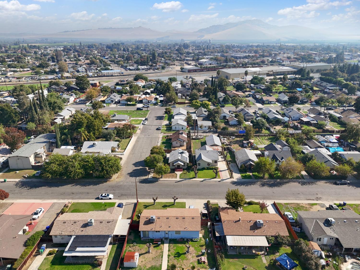 321 North Orange Avenue Exeter, CA 93221 - Photo 31 of 37 an aerial view of a city with lots of residential buildings