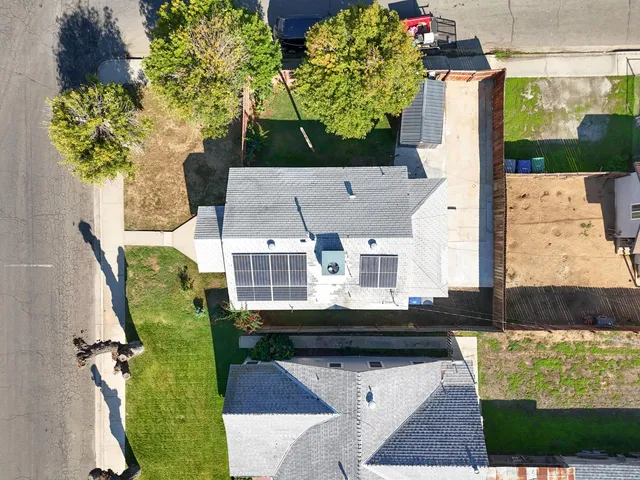 an aerial view of a house with a garden
