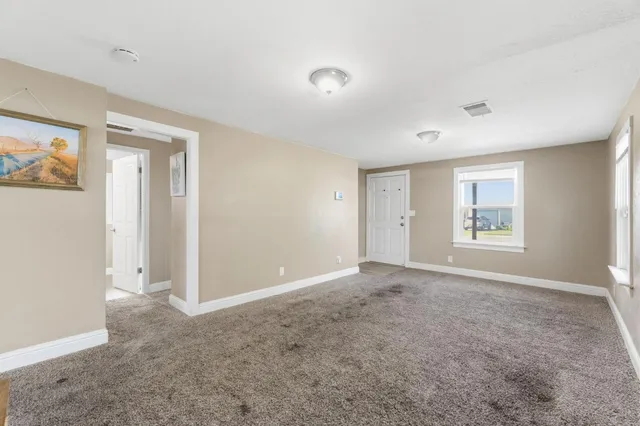 a view of an empty room with a window