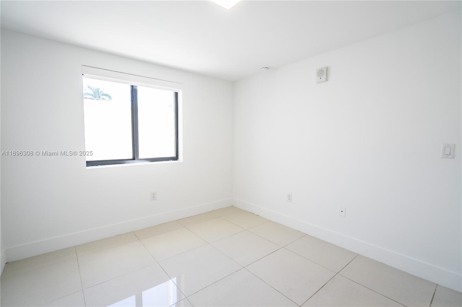 1971 Bay Drive, Unit 102 Miami Beach, FL 33141 - Photo 15 of 24 an empty room with a window