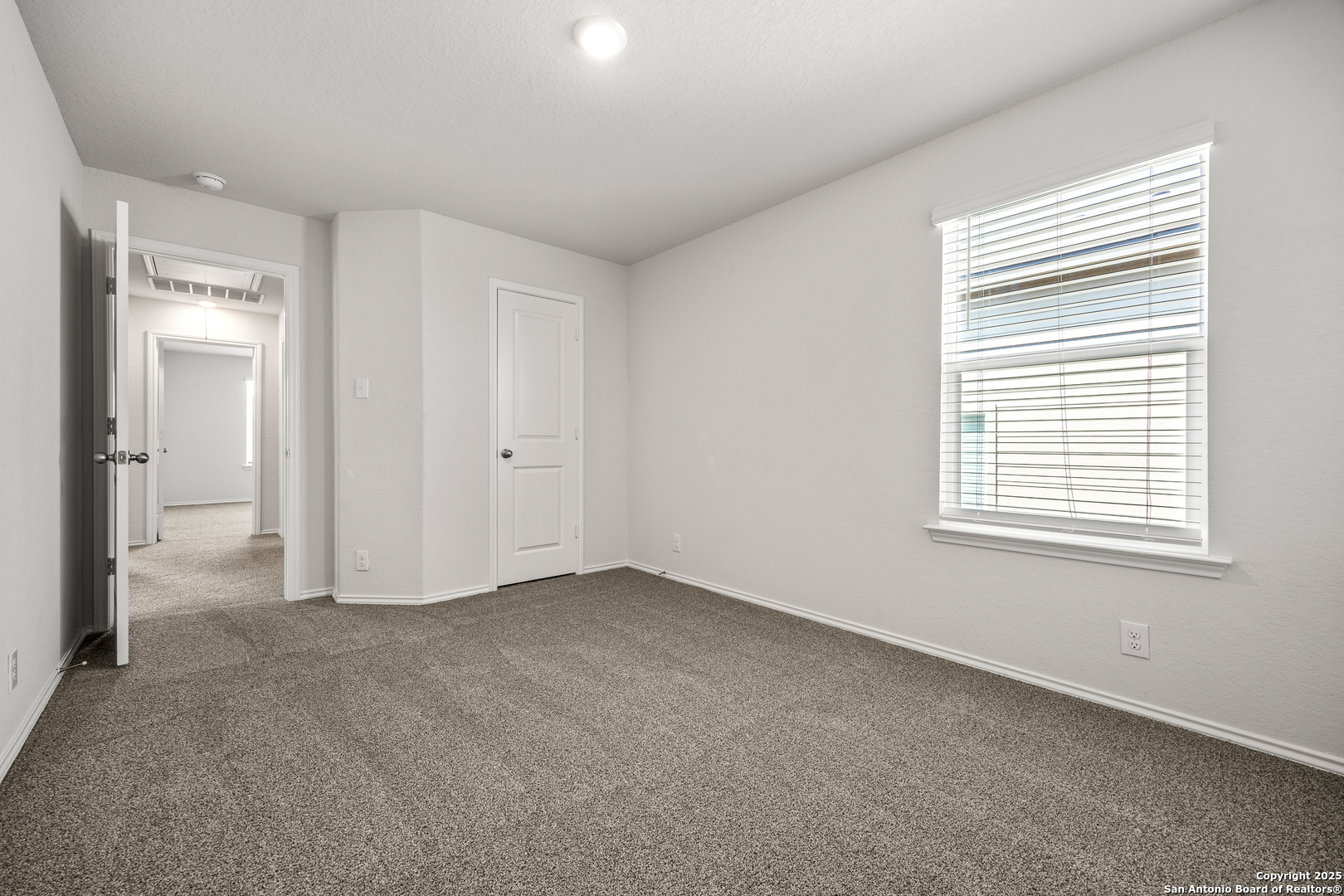 208 Greater Scaup San Antonio, TX 78253 - Photo 14 of 18 an empty room with a window and a bathroom