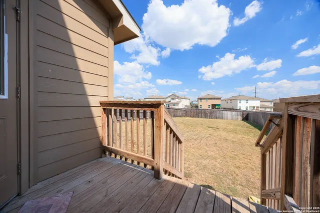 a view of balcony with wooden floor