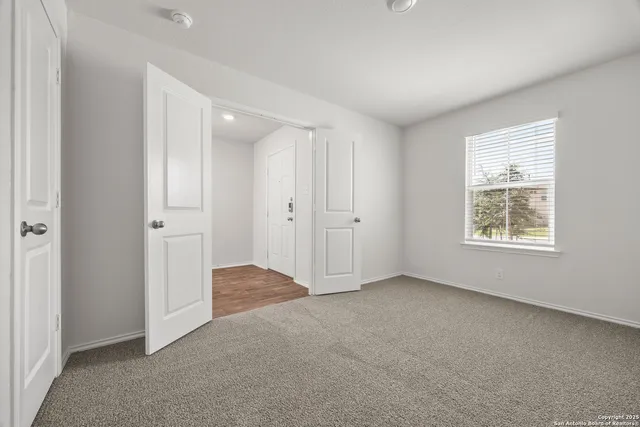 an empty room with windows