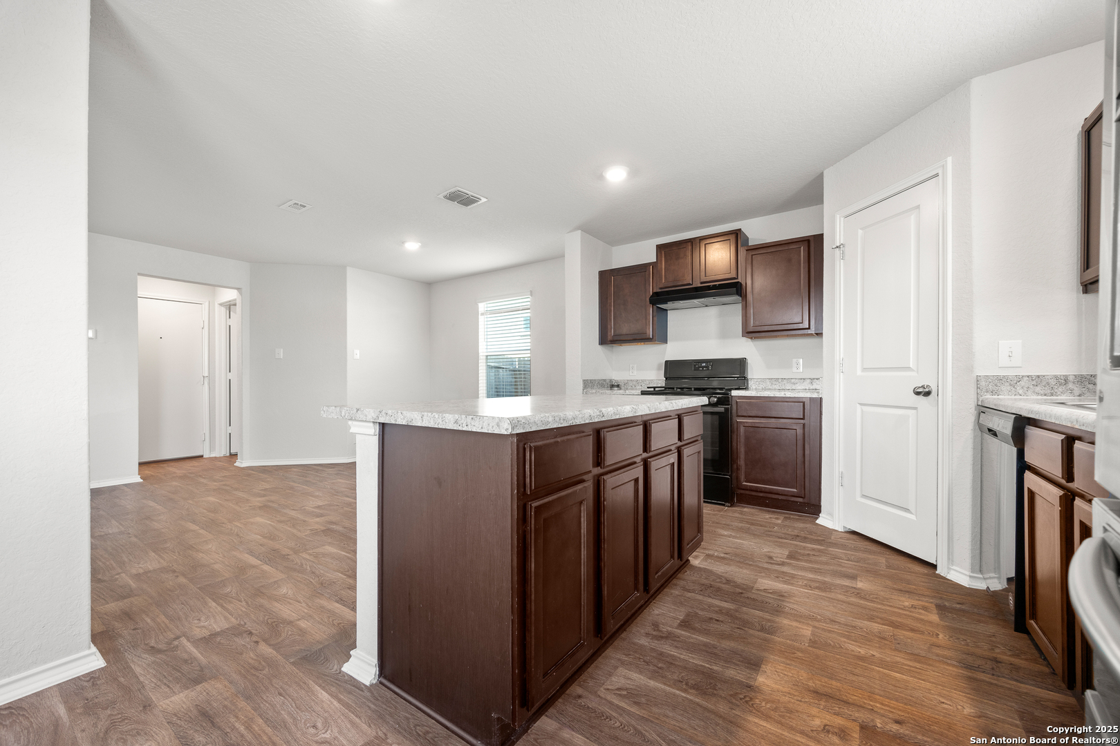 208 Greater Scaup San Antonio, TX 78253 - Photo 9 of 18 a kitchen with stainless steel appliances granite countertop a refrigerator and a stove top oven