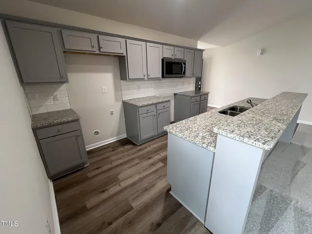 a kitchen with a appliances and cabinets