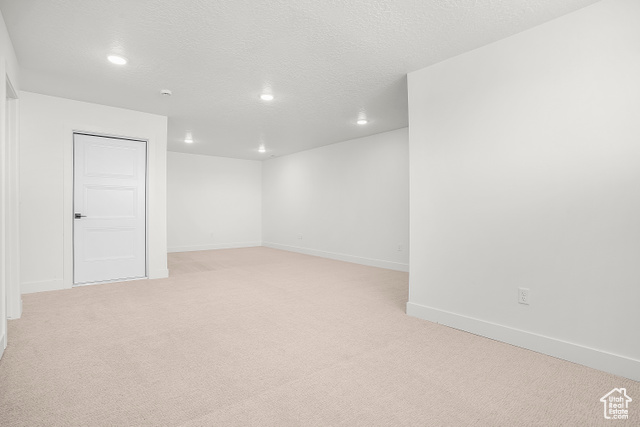 1631 West Century Lane, Unit B Mapleton, UT 84664 - Photo 24 of 33 Basement featuring light carpet, a textured ceiling, and recessed lighting