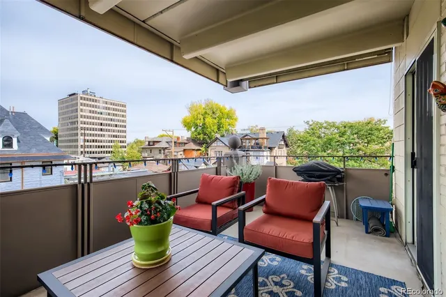 a kitchen with a refrigerator and a sink