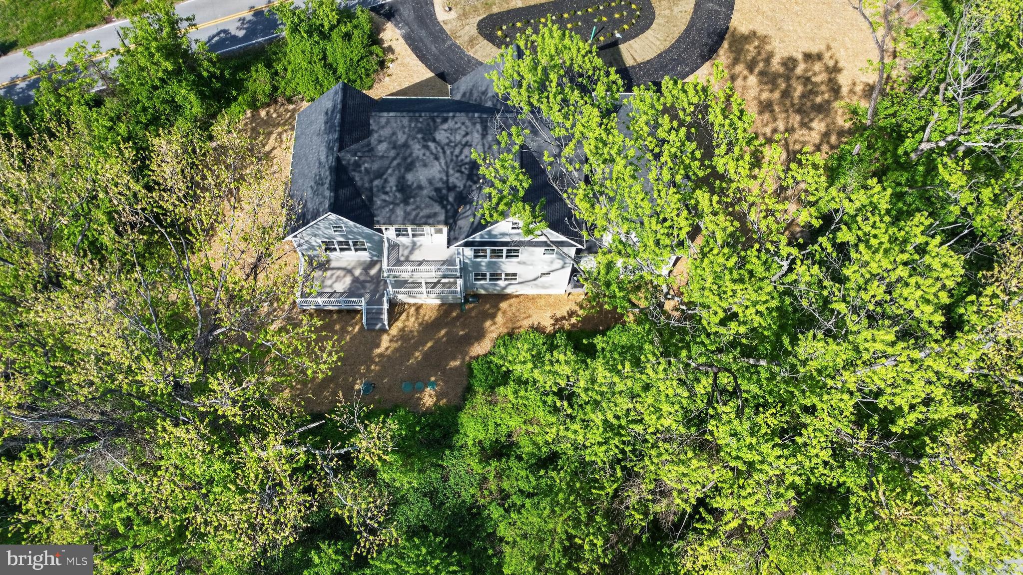 2001 Poplar Ridge Road Pasadena, MD 21122 - Photo 76 of 83 an aerial view of a house with a yard and large trees