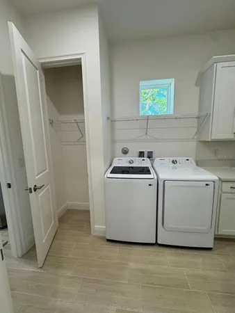 a utility room with washer and dryer