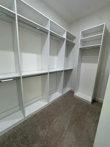 a view of an empty walk in closet