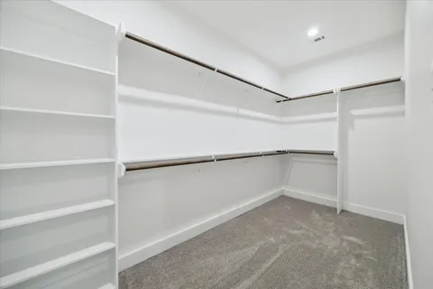 a view of an empty walk in closet