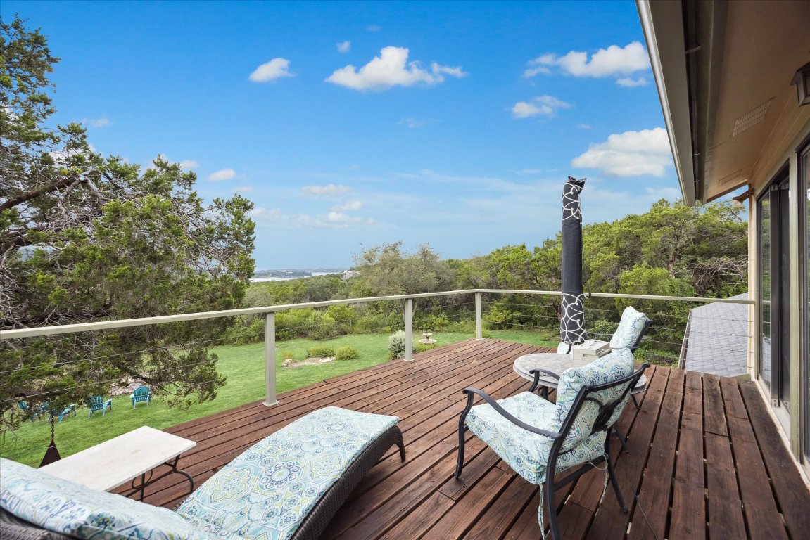 7806 Comanche Trail Leander, TX 78641 - Photo 24 of 32 a view of a balcony with wooden floor and outdoor space
