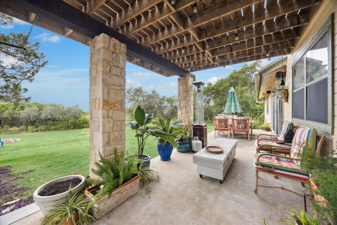 7806 Comanche Trail Leander, TX 78641 - Photo 25 of 32 a outdoor living space with furniture and garden view