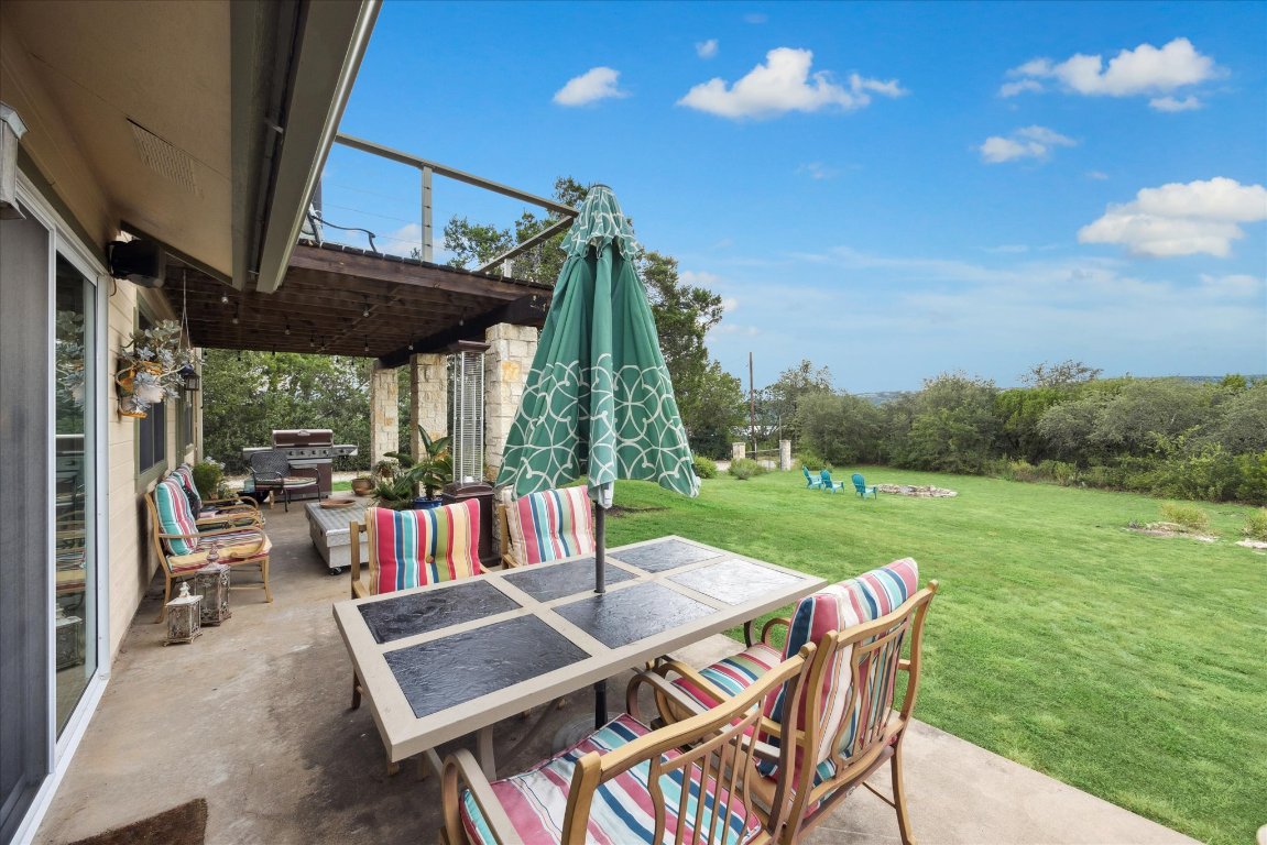 7806 Comanche Trail Leander, TX 78641 - Photo 26 of 32 a view of an outdoor sitting area with furniture and garden