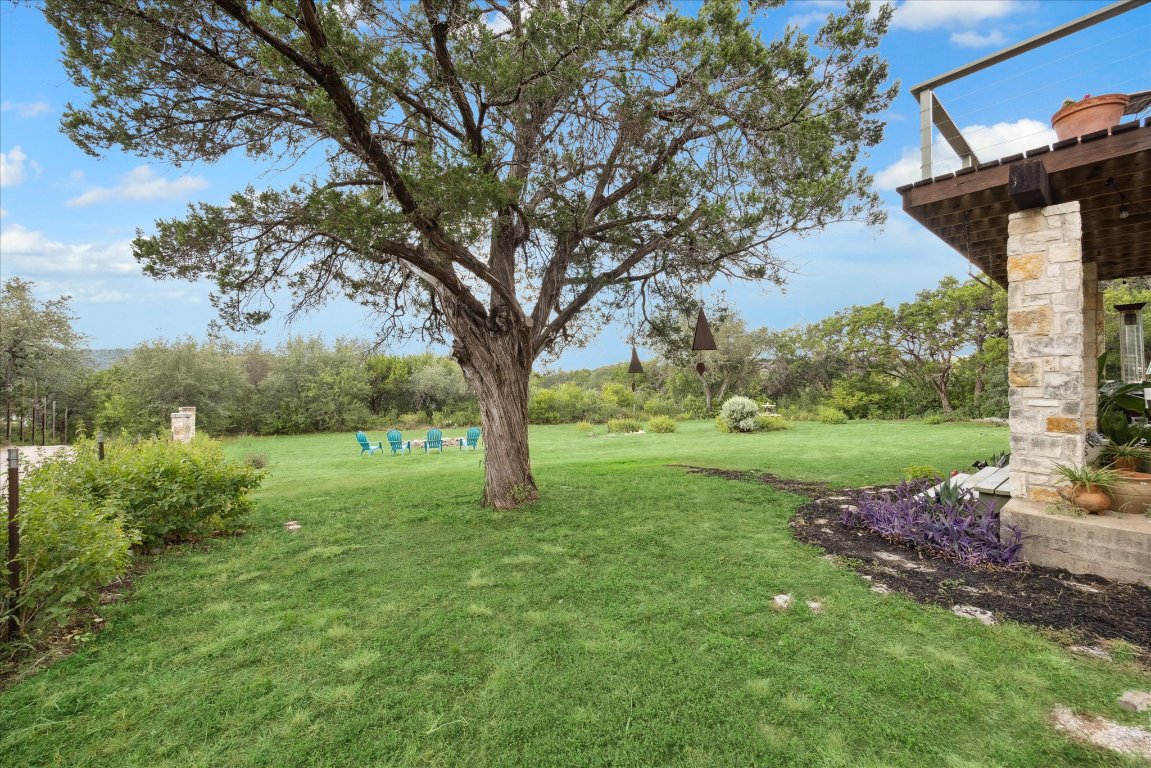 7806 Comanche Trail Leander, TX 78641 - Photo 28 of 32 a view of backyard with large trees