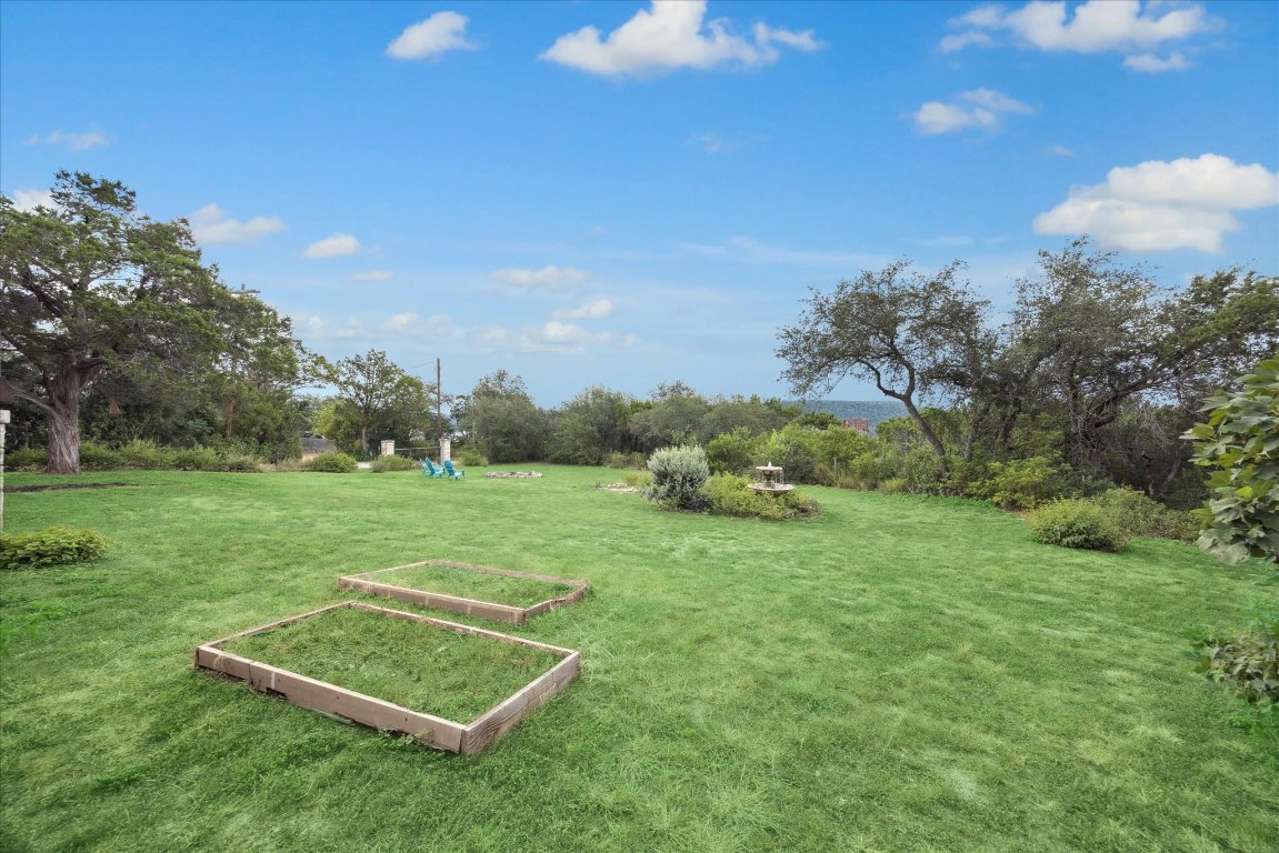 7806 Comanche Trail Leander, TX 78641 - Photo 32 of 32 a view of a golf course with a lake
