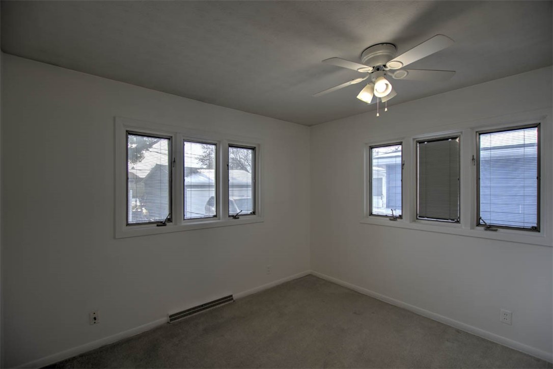 155 Columbus Drive Decatur, IL 62526 - Photo 13 of 30 a view of a livingroom with a ceiling fan and window