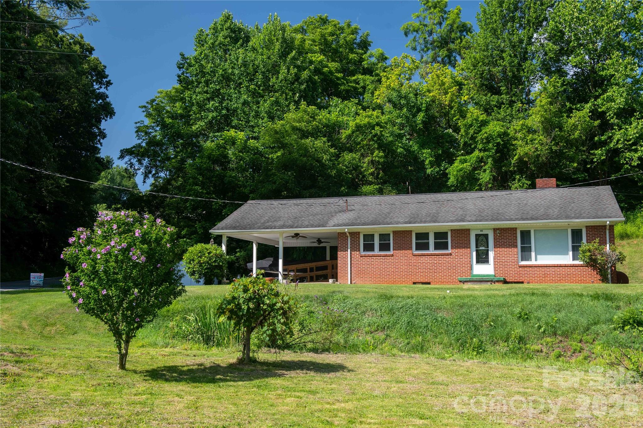 40 Double Island Road Burnsville, NC 28714 - Photo 4 of 38 a front view of a house with a yard