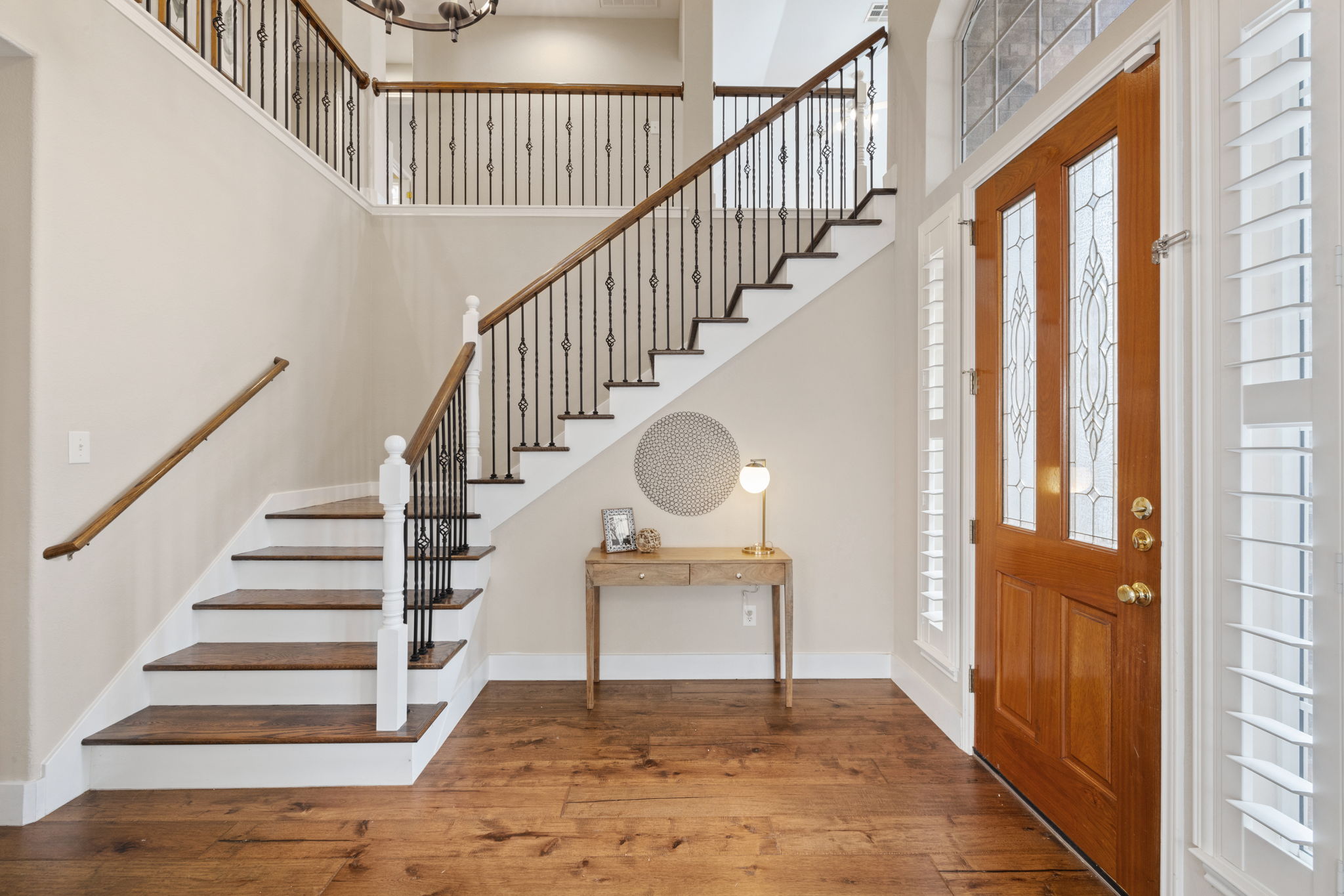 8112 Cobblestone Austin, TX 78735 - Photo 4 of 33 Entrance foyer with stairs, a towering ceiling, and wood-type flooring
