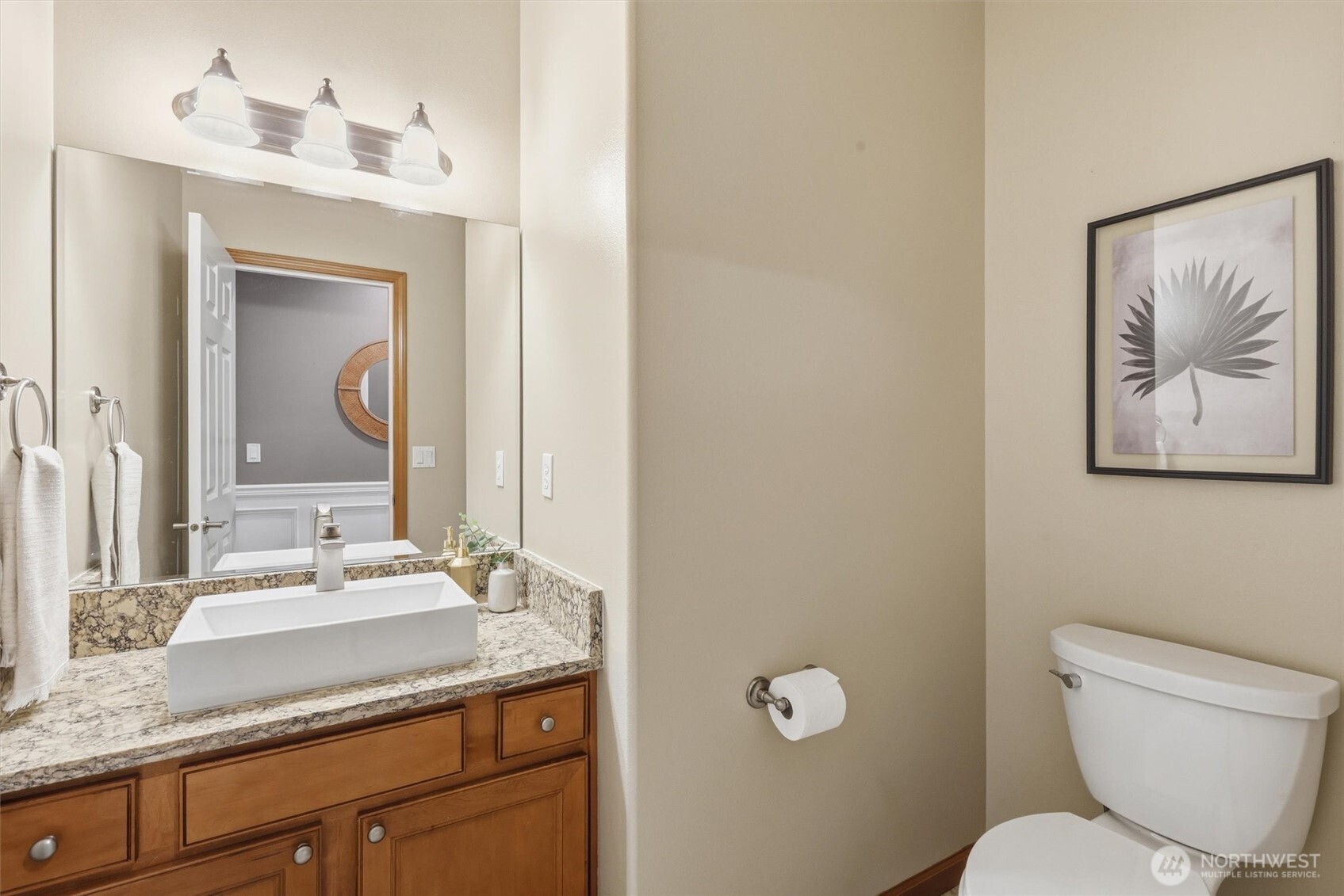 4202 Silvana Terrace Road Stanwood, WA 98292 - Photo 24 of 40 a bathroom with a toilet a sink and mirror