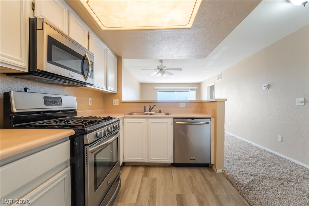 8070 West Russell Road, Unit 2024 Las Vegas, NV 89113 - Photo 8 of 19 A well-appointed kitchen features modern appliances and a functional layout for daily living.