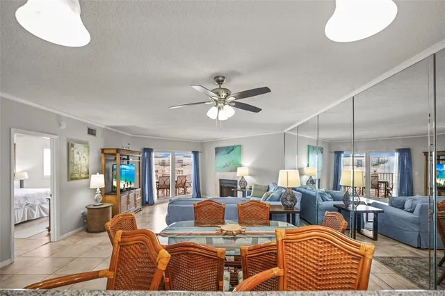 a living room with fireplace furniture and a table