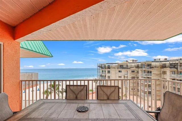 a view of a patio with a table and chairs