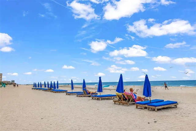 a view of a tall building with a yard