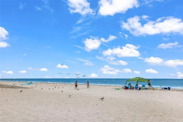 a view of a swimming pool with a bench