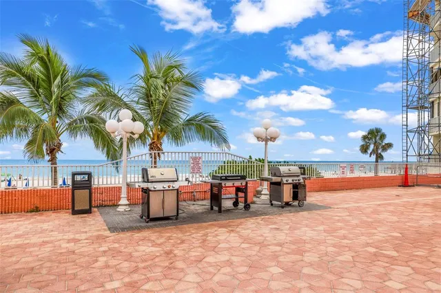 a view of a balcony with a barbeque