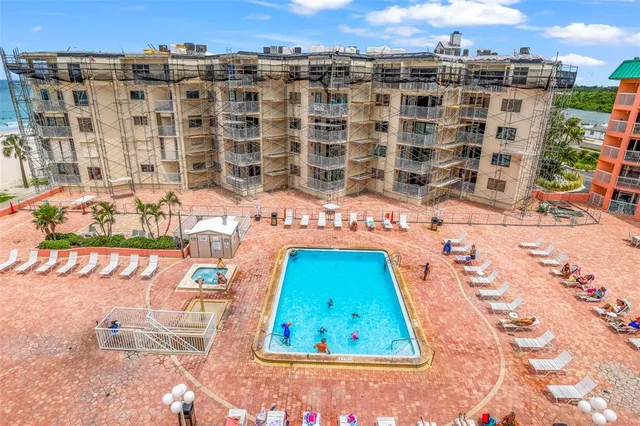 a view of parking garage with cars parked