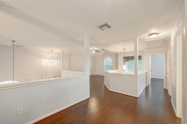 a view of a kitchen cabinets and wooden floor
